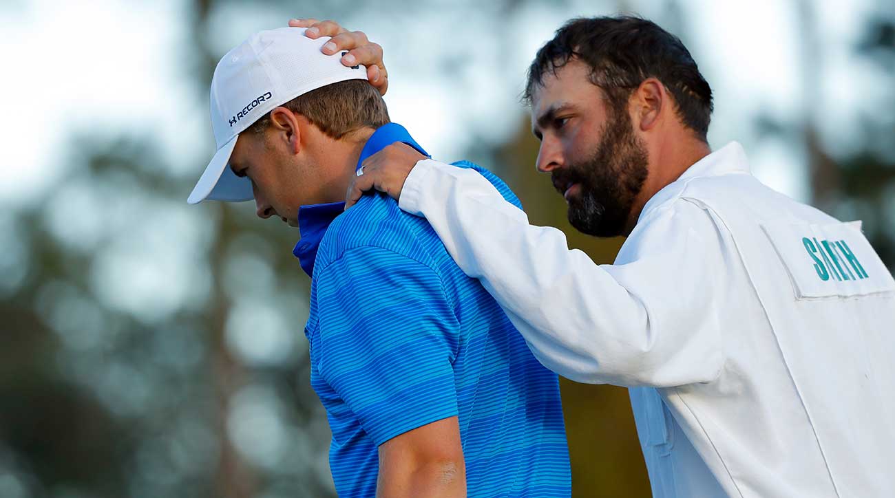 Spieth's caddie, Michael Greller, consoles him at the 2016 Masters.
