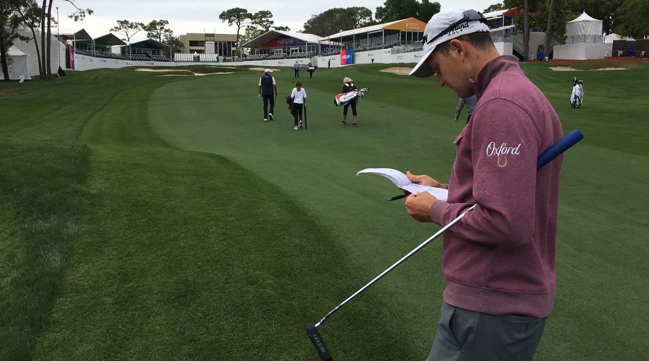 Martin Trainer consults his yardage book