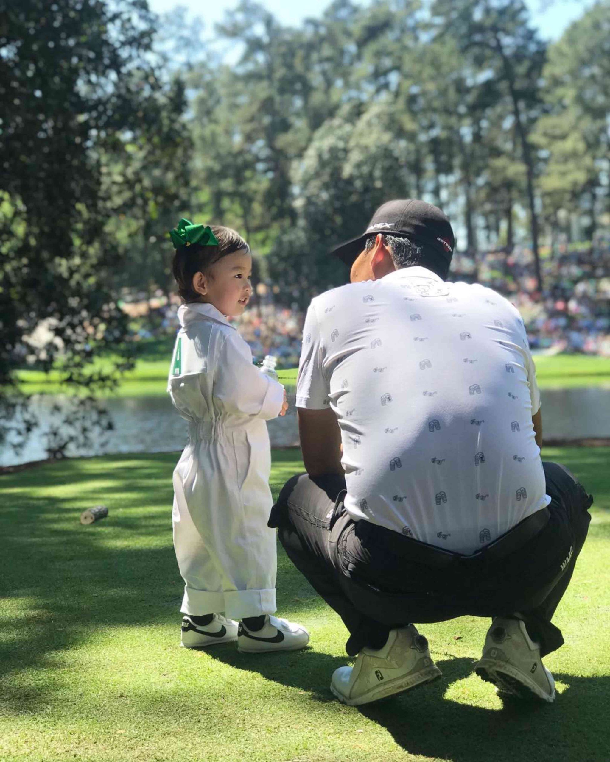 Kevin Na shares a special moment with his daughter.