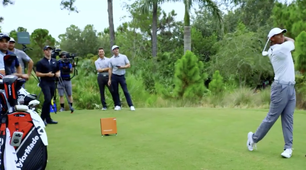 Tiger Woods takes a cut with TaylorMade's Pittsburgh Persimmon driver.