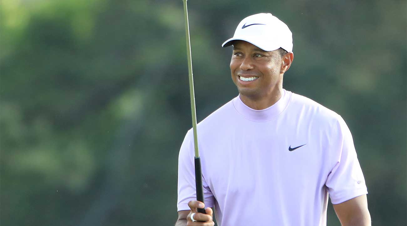 Tiger Woods smiles during the third round of the Masters.