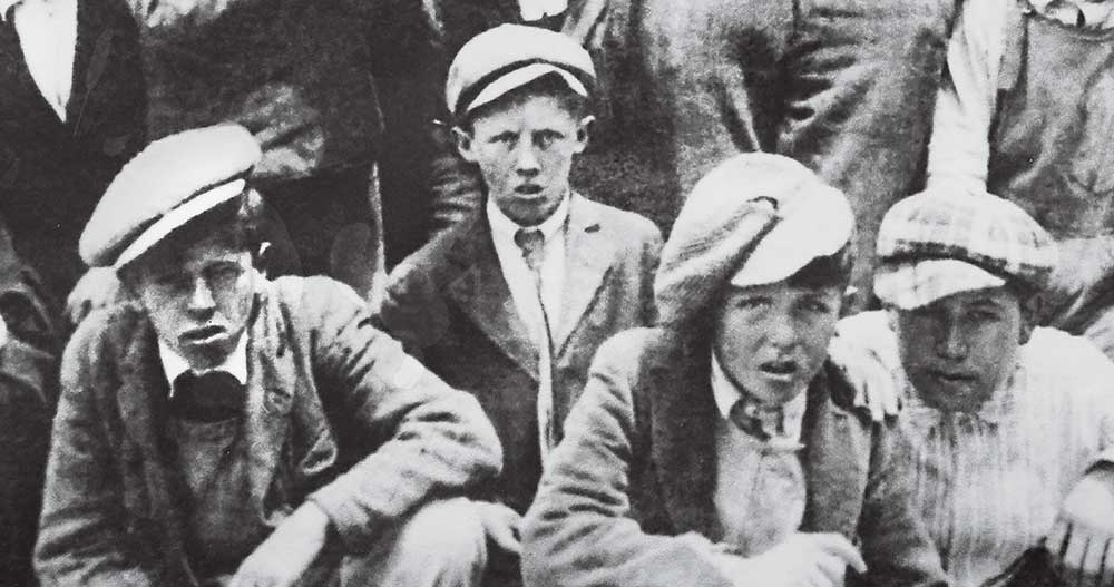 By the time Pebble opened in 1919, Al Santos (far left) had loops under his belt, having caddied at nearby Del Monte Golf Course. 