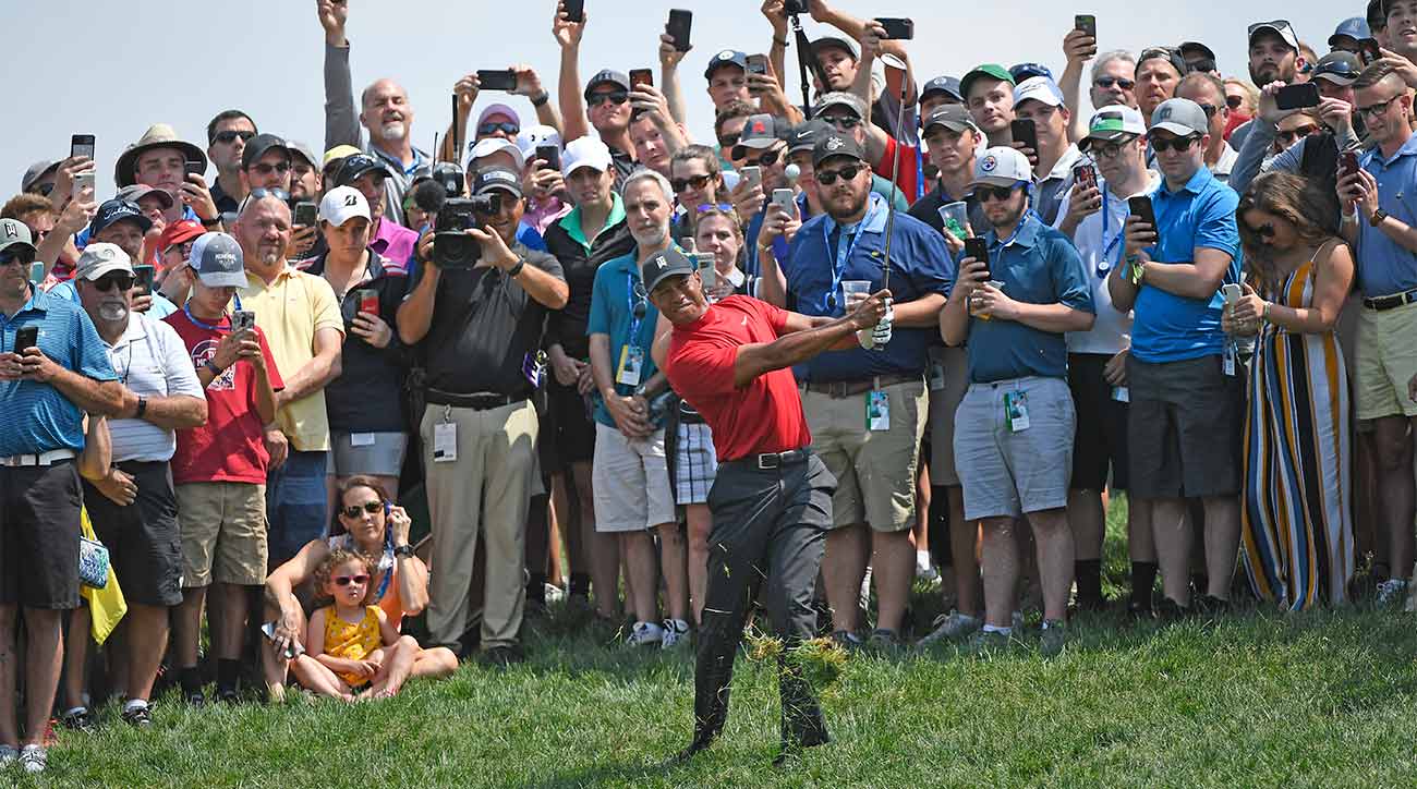 Tiger Woods blasts a shot out of the rough during the final round of the Memorial on Sunday.
