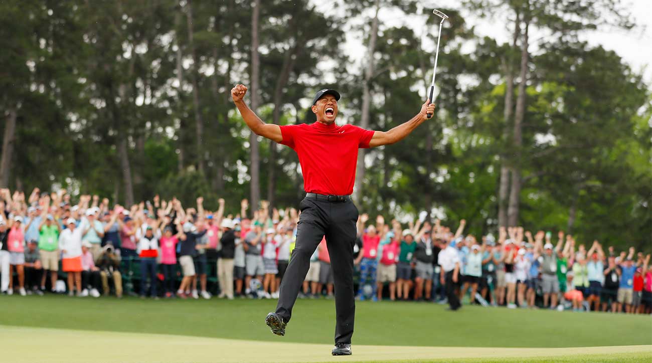 Tiger Woods celebrates his fifth Masters victory on the 18th green at Augusta National.