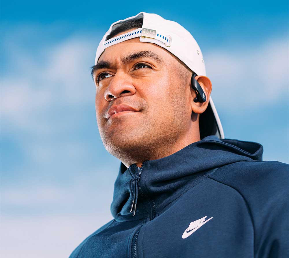 Tony Finau looks off in the distance.