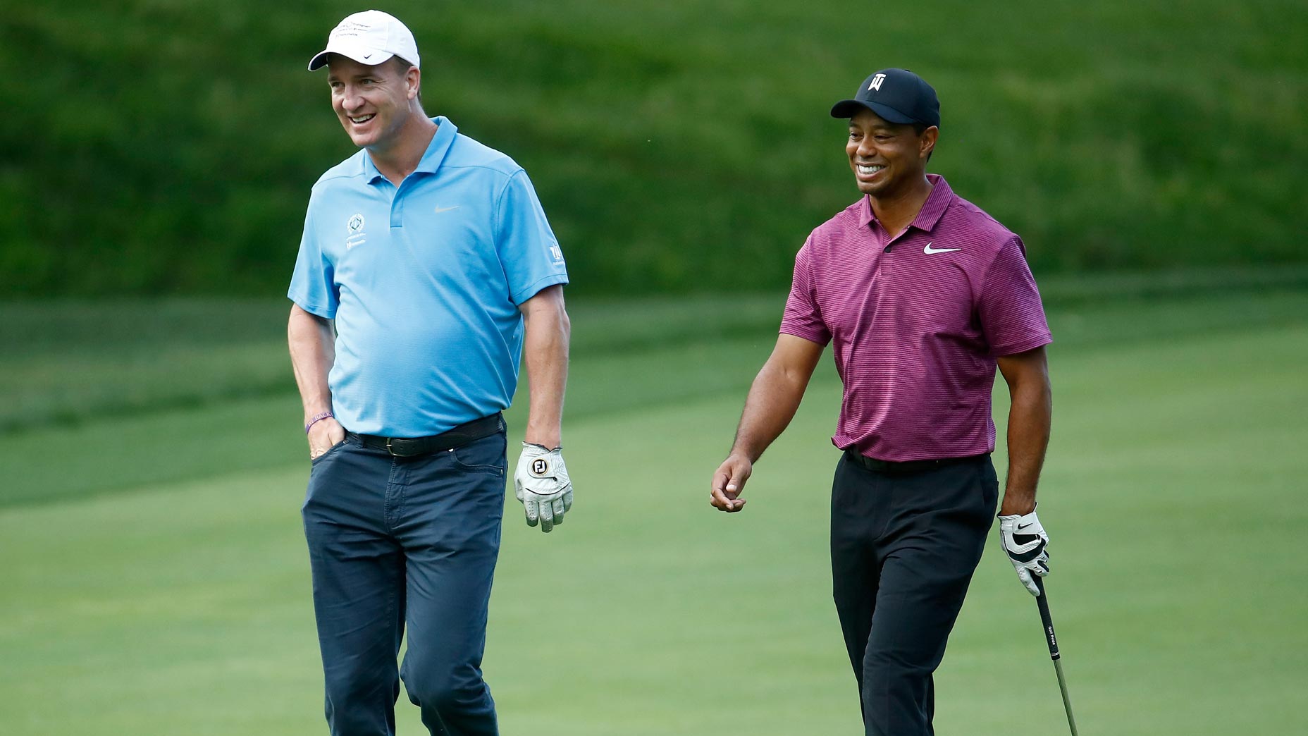 peyton manning and tiger woods laugh