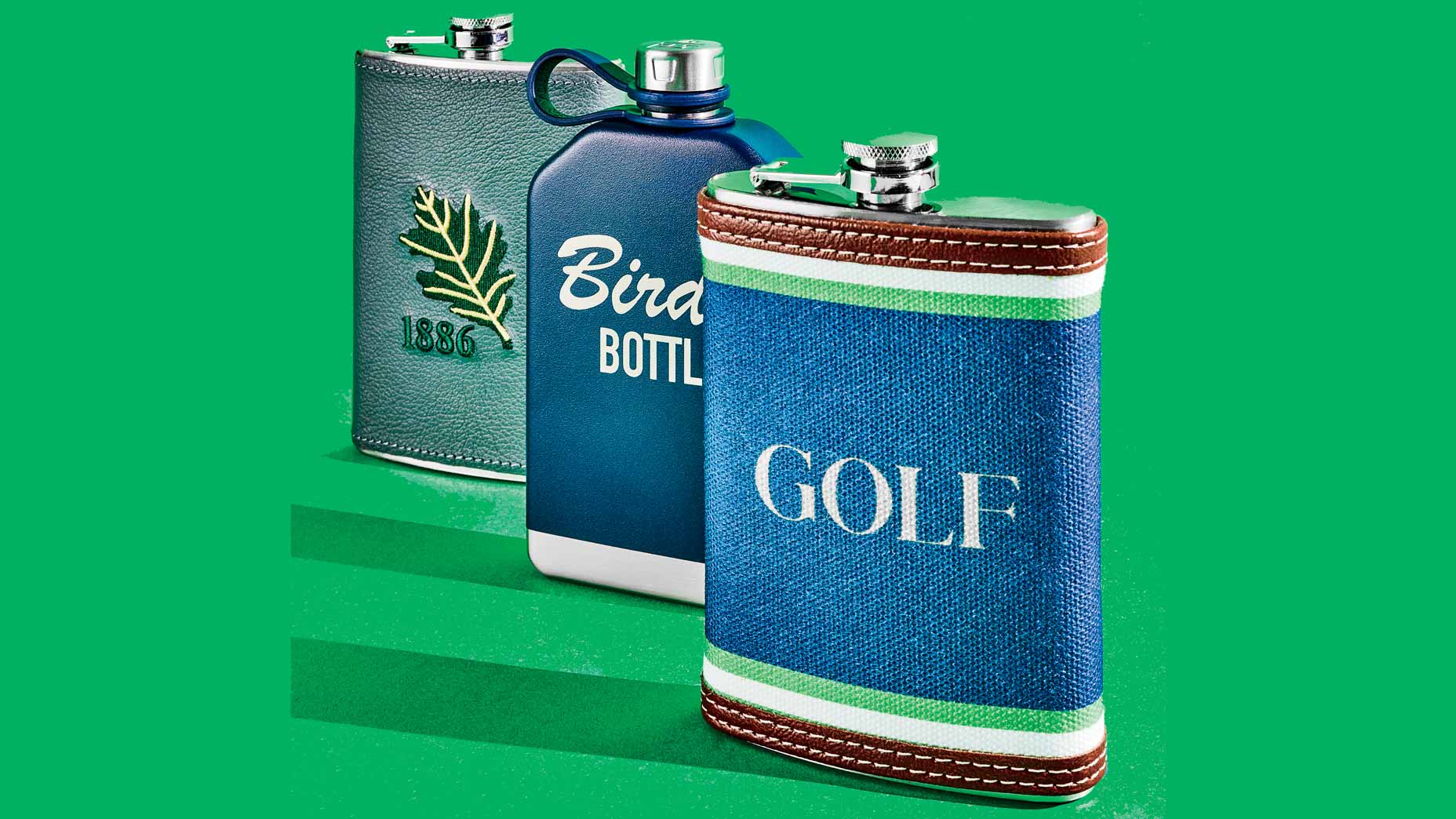 three flasks on green background