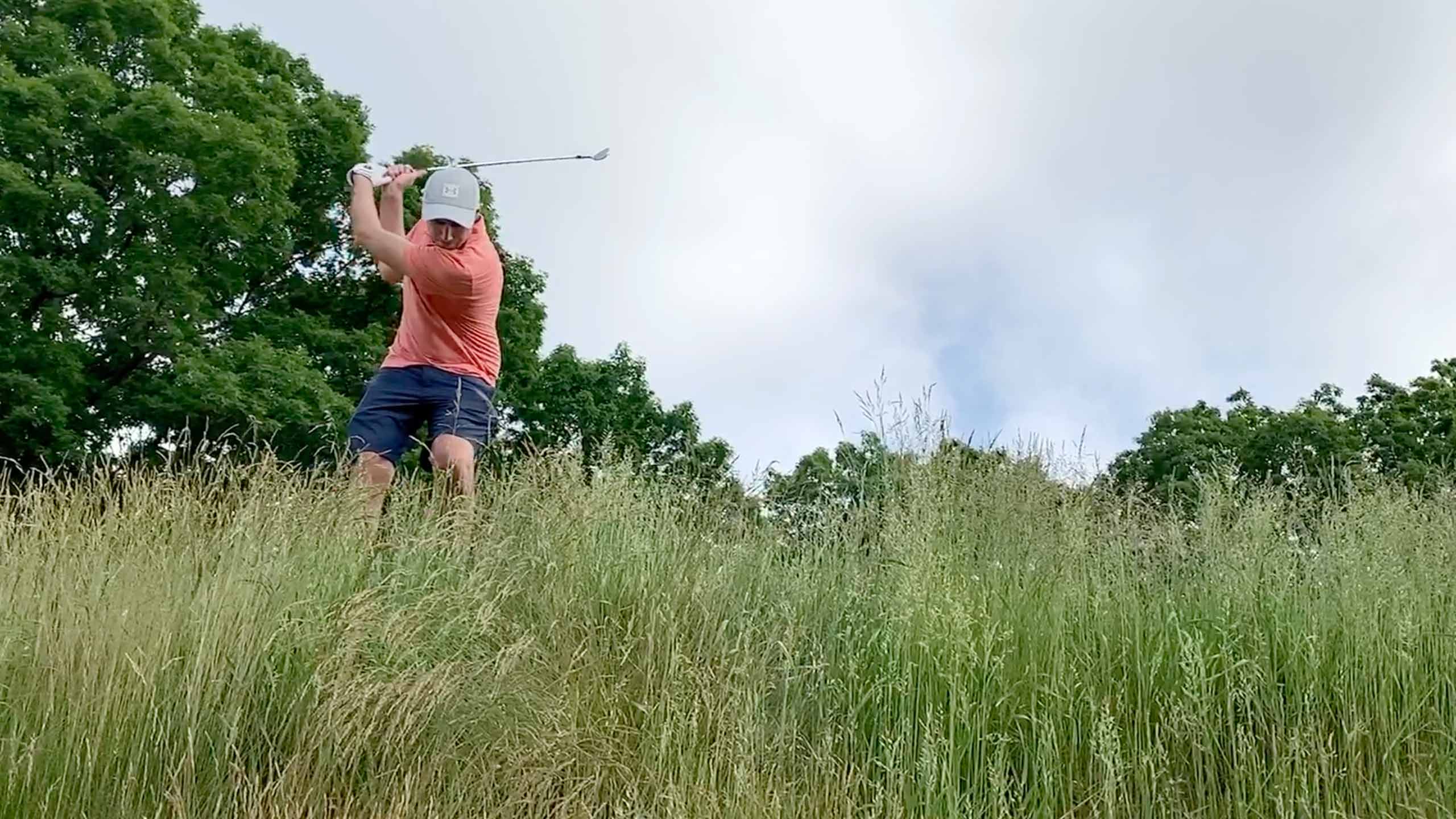 Tim Reilly hits out of the Bethpage rough.