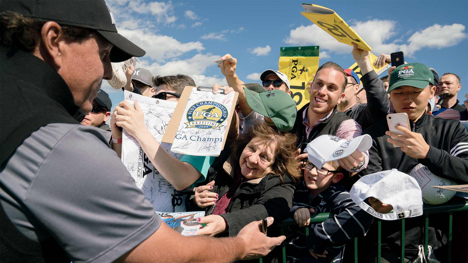 Phil Mickelson signing for fans.
