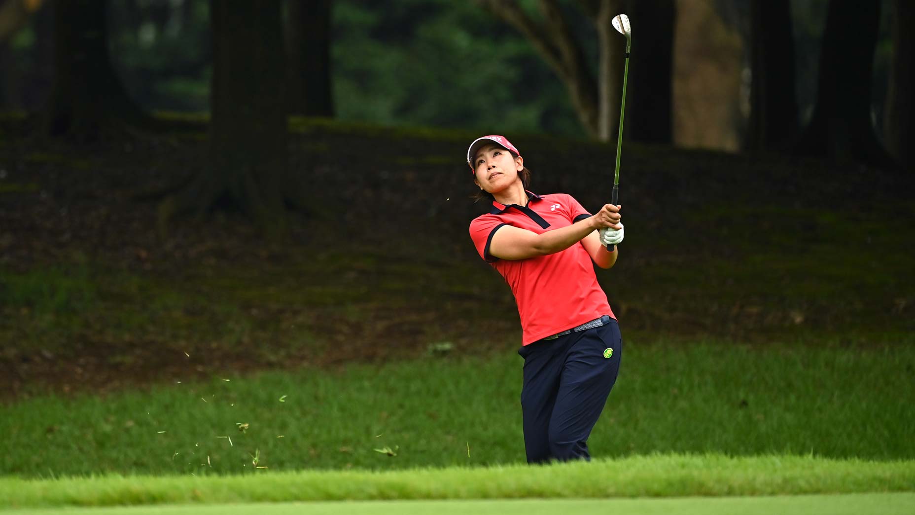 woman hits pitch shot