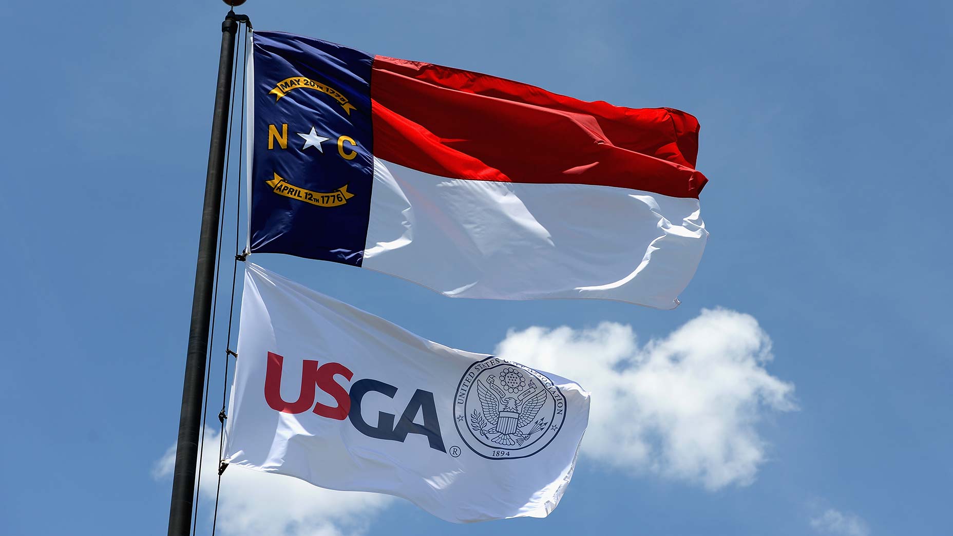 usga and north carolina flags fly