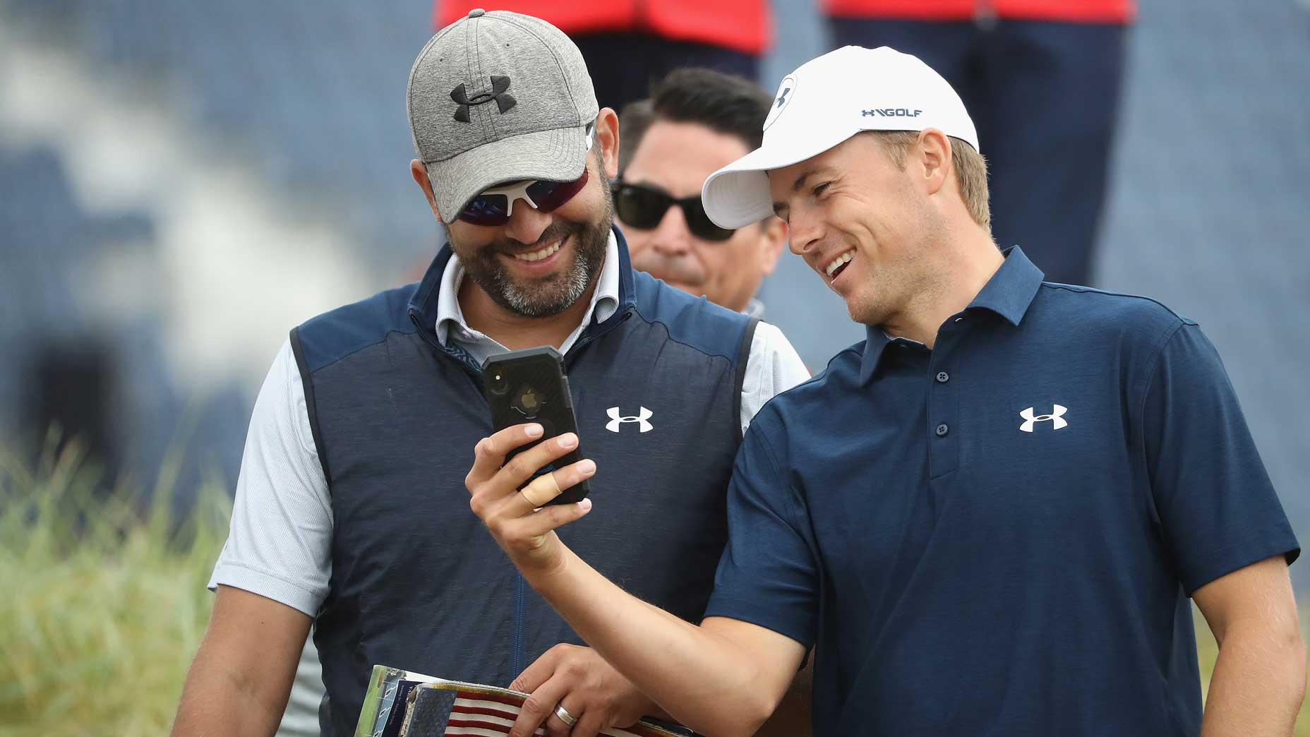 jordan spieth and michael greller laugh at phone