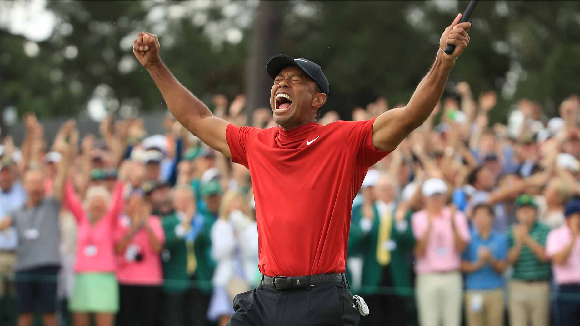 tiger woods celebrates