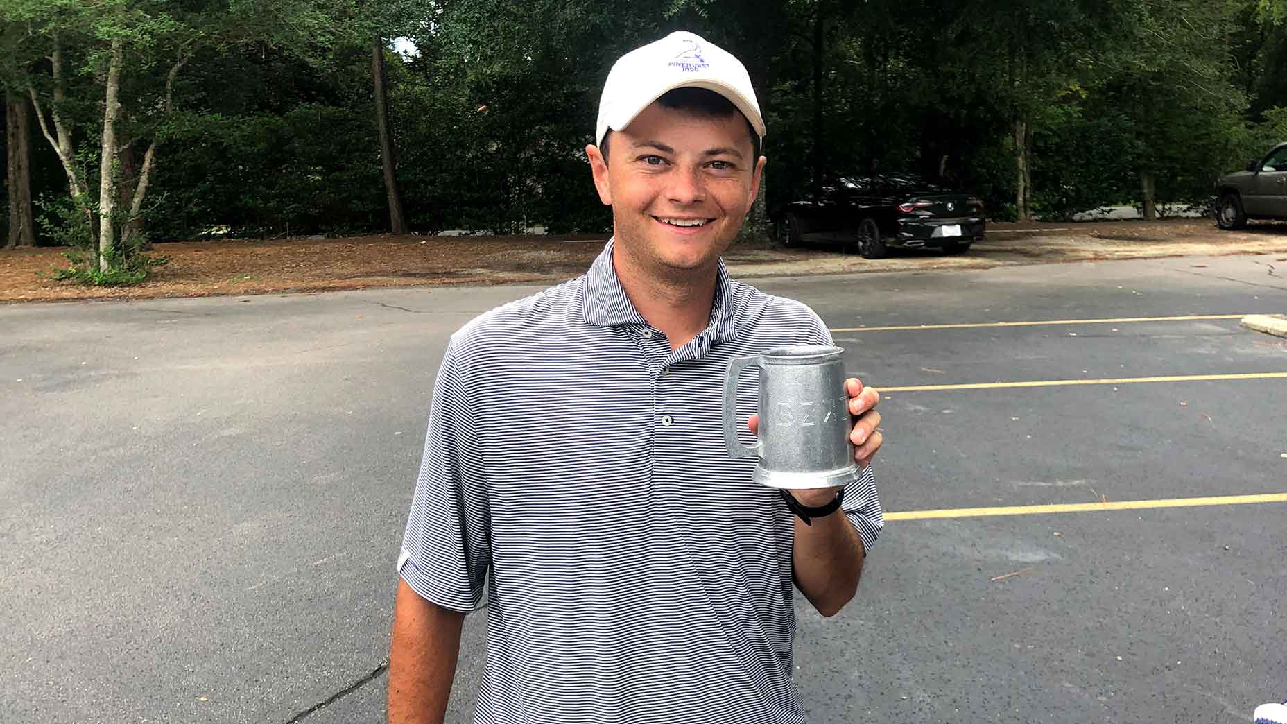 tim leonard holds cup