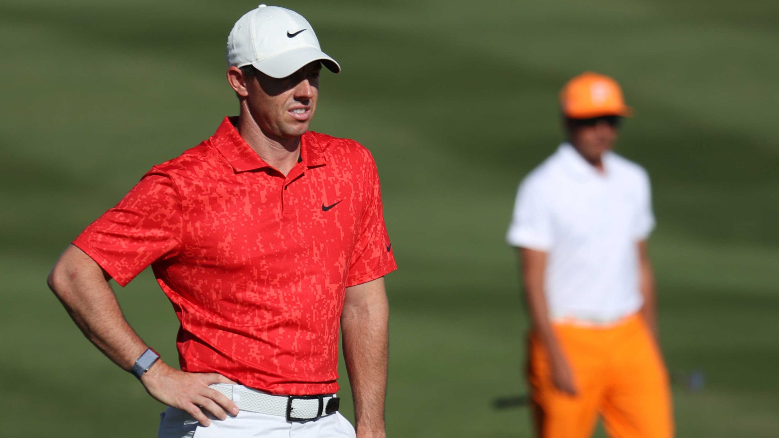 Rory McIlroy of Northern Ireland lines up a putt on the fourth green as Rickie Fowler of the United States during the final round of THE CJ CUP @ SUMMIT at The Summit Club