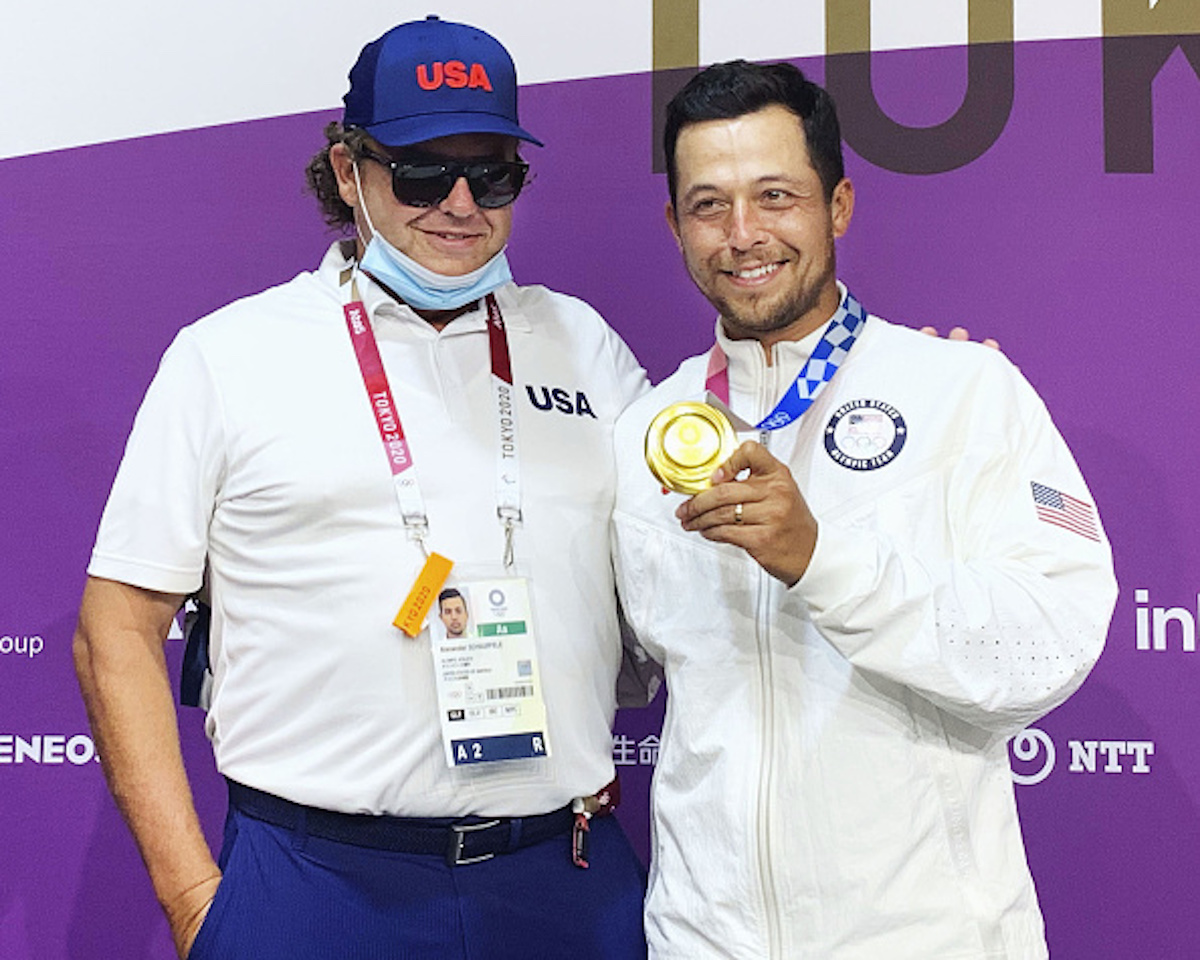 Xander Schauffele (R) of the United States poses for a photo with his father and swing coach Stefan Schauffele after winning the Tokyo Olympic men's golf tournament on Aug. 1, 2021, at Kasumigaseki Country Club in Kawagoe, Saitama Prefecture, near Tokyo. (Photo by Kyodo News via Getty Images)