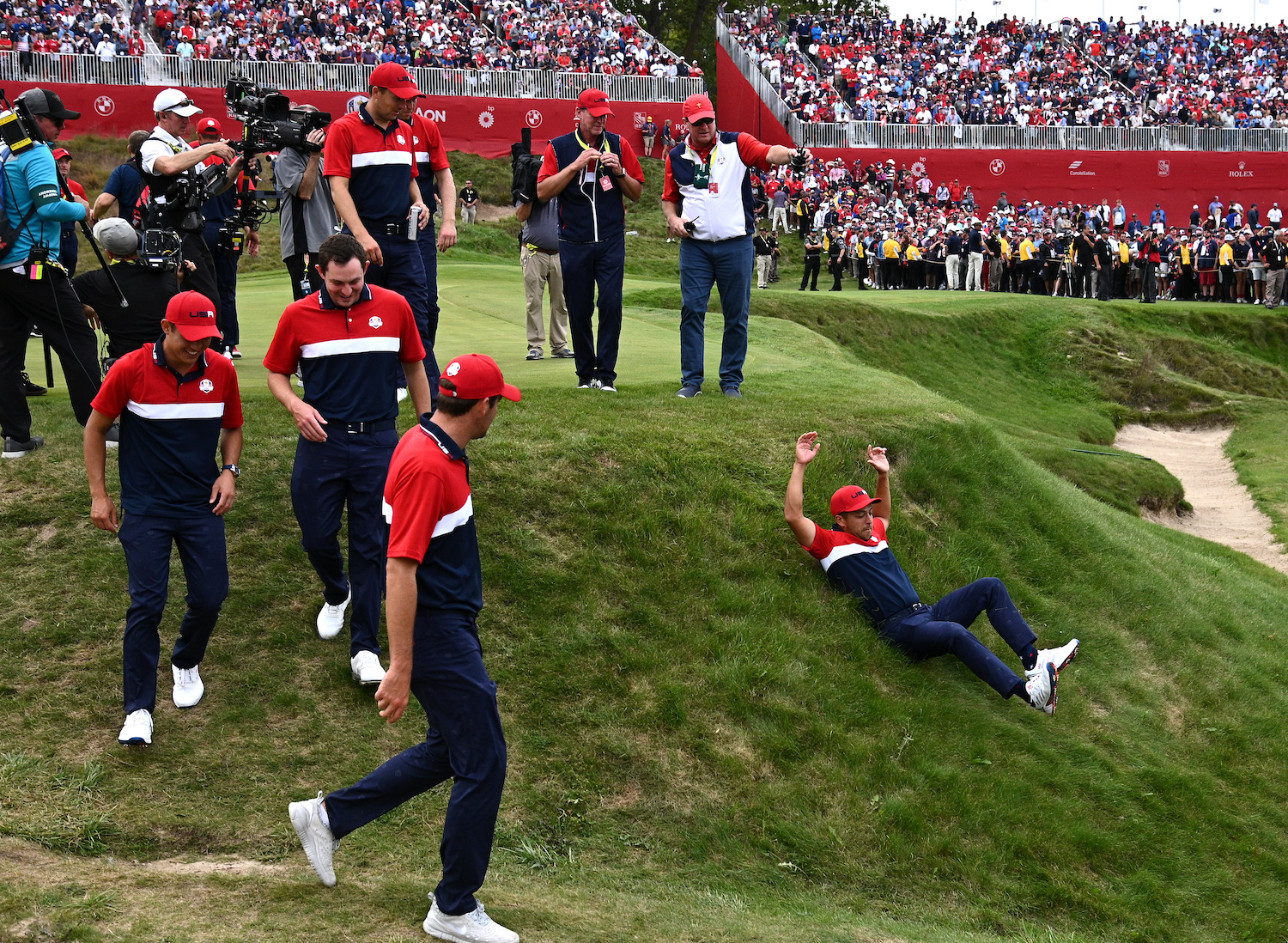 Xander Schauffele with a celebratory slide at the Ryder Cup.