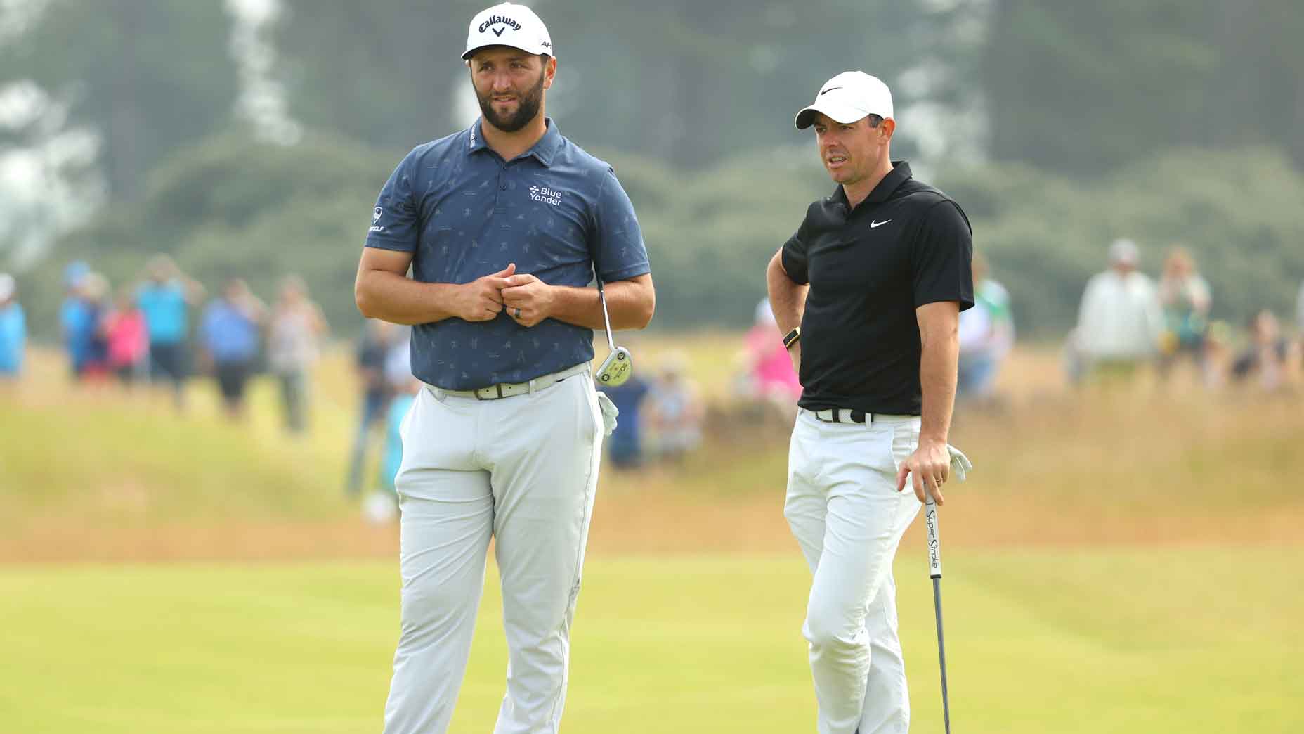 rory mcilroy and jon rahm stand