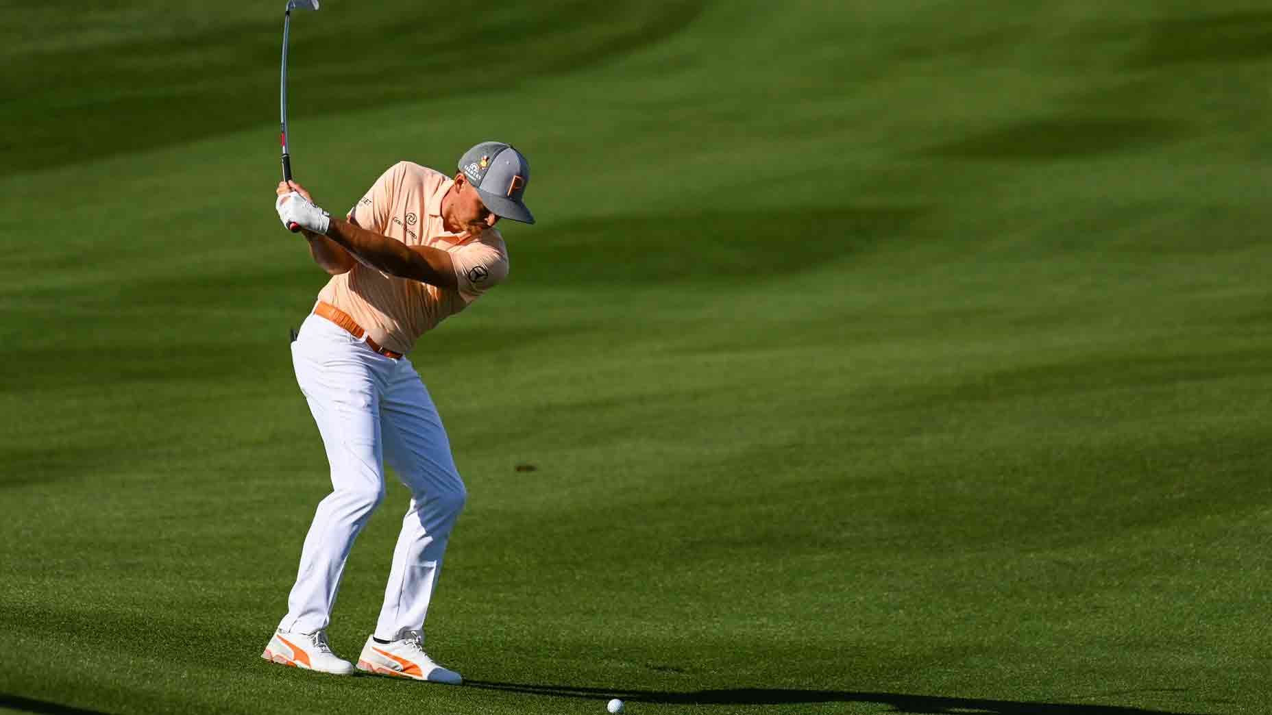 rickie fowler hits ball of downhill lie