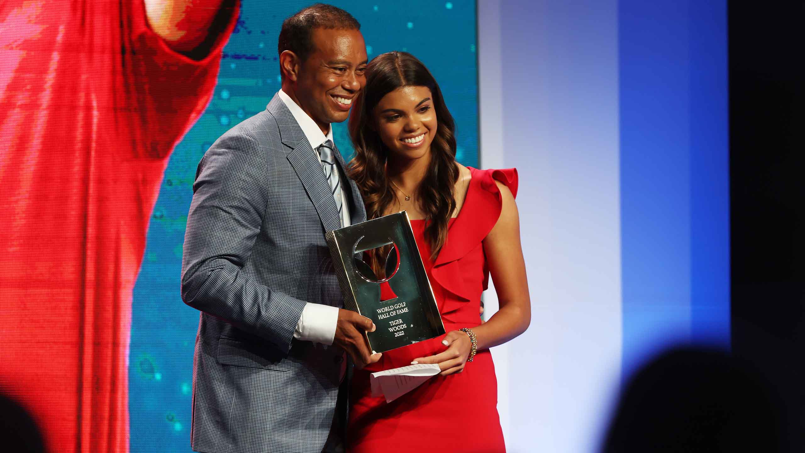 tiger and sam woods pose for photo