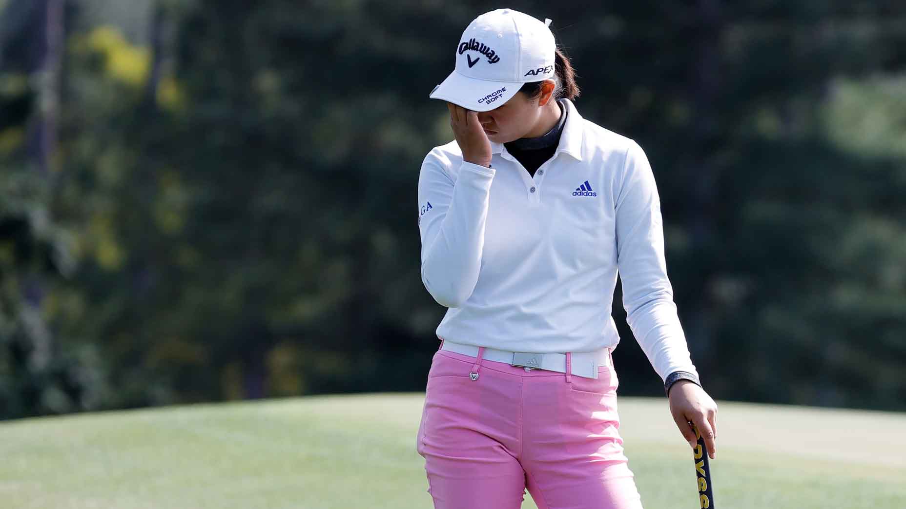 rose zhang puts hands on her head