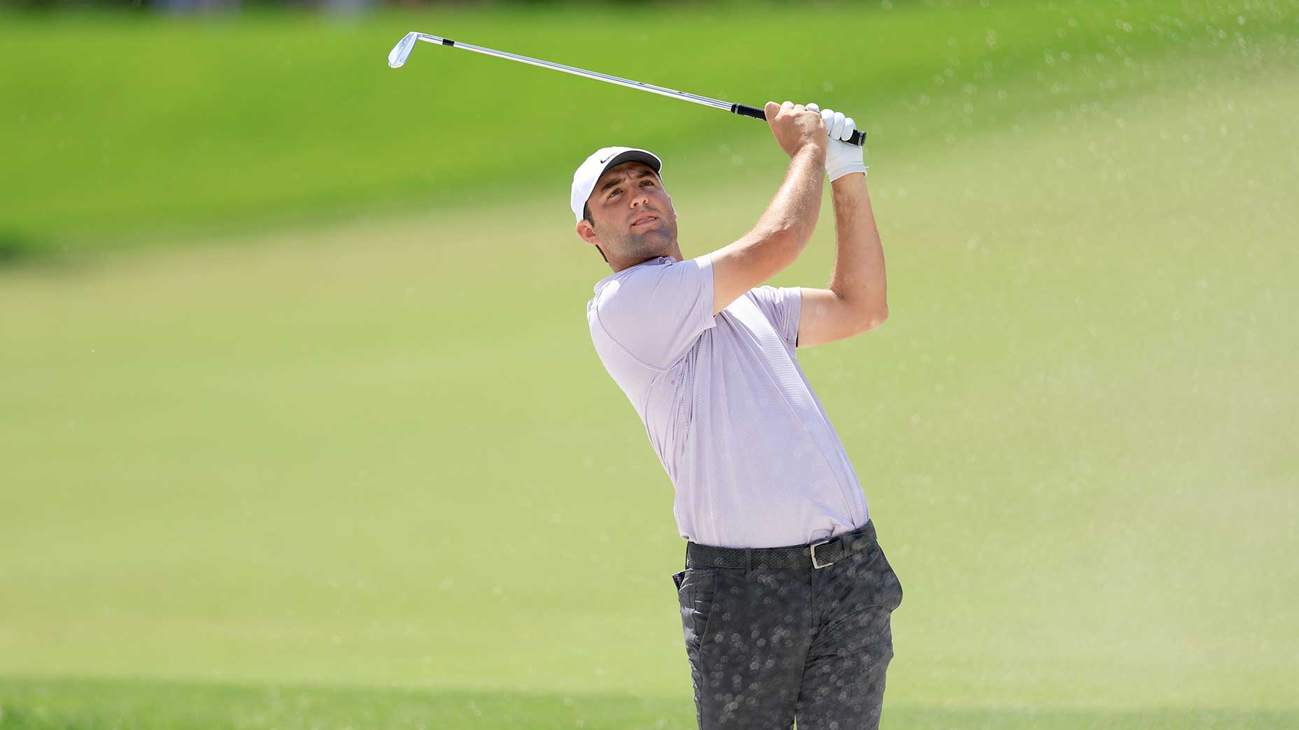 Scottie scheffler takes a swing at bay hill