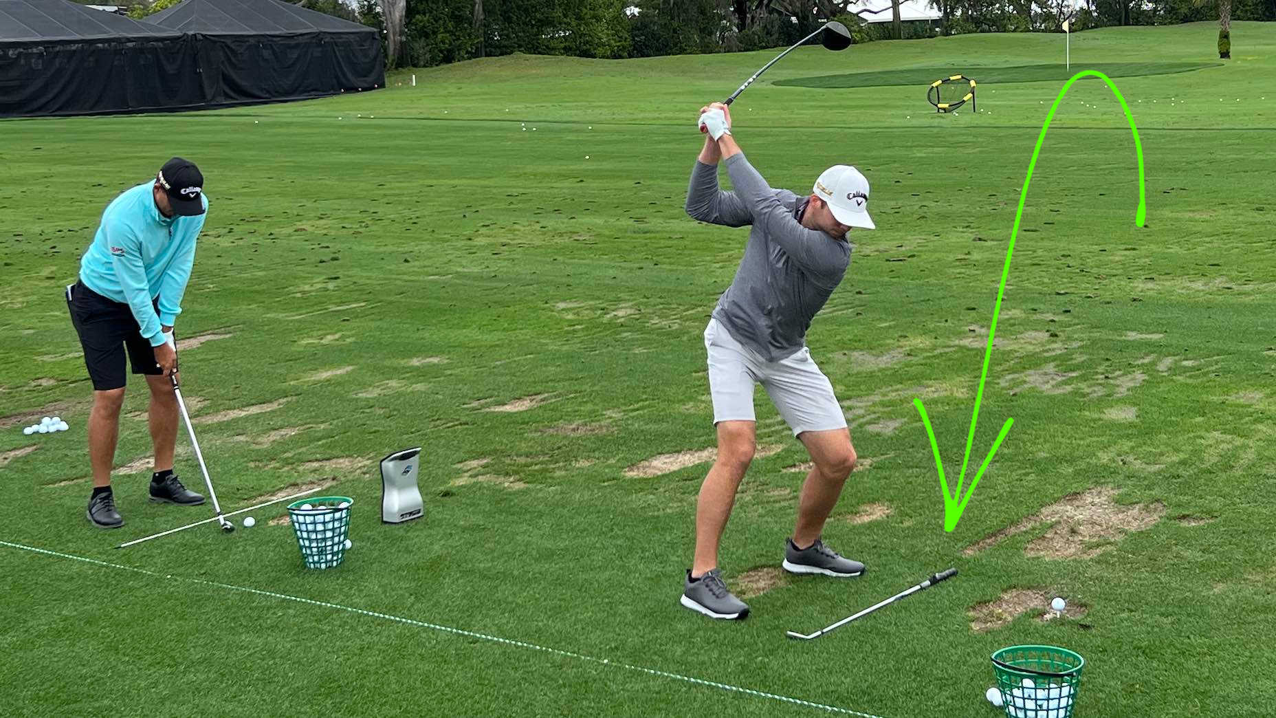 PGA Tour pros practice with alignment sticks on driving range at Arnold Palmer Invitational