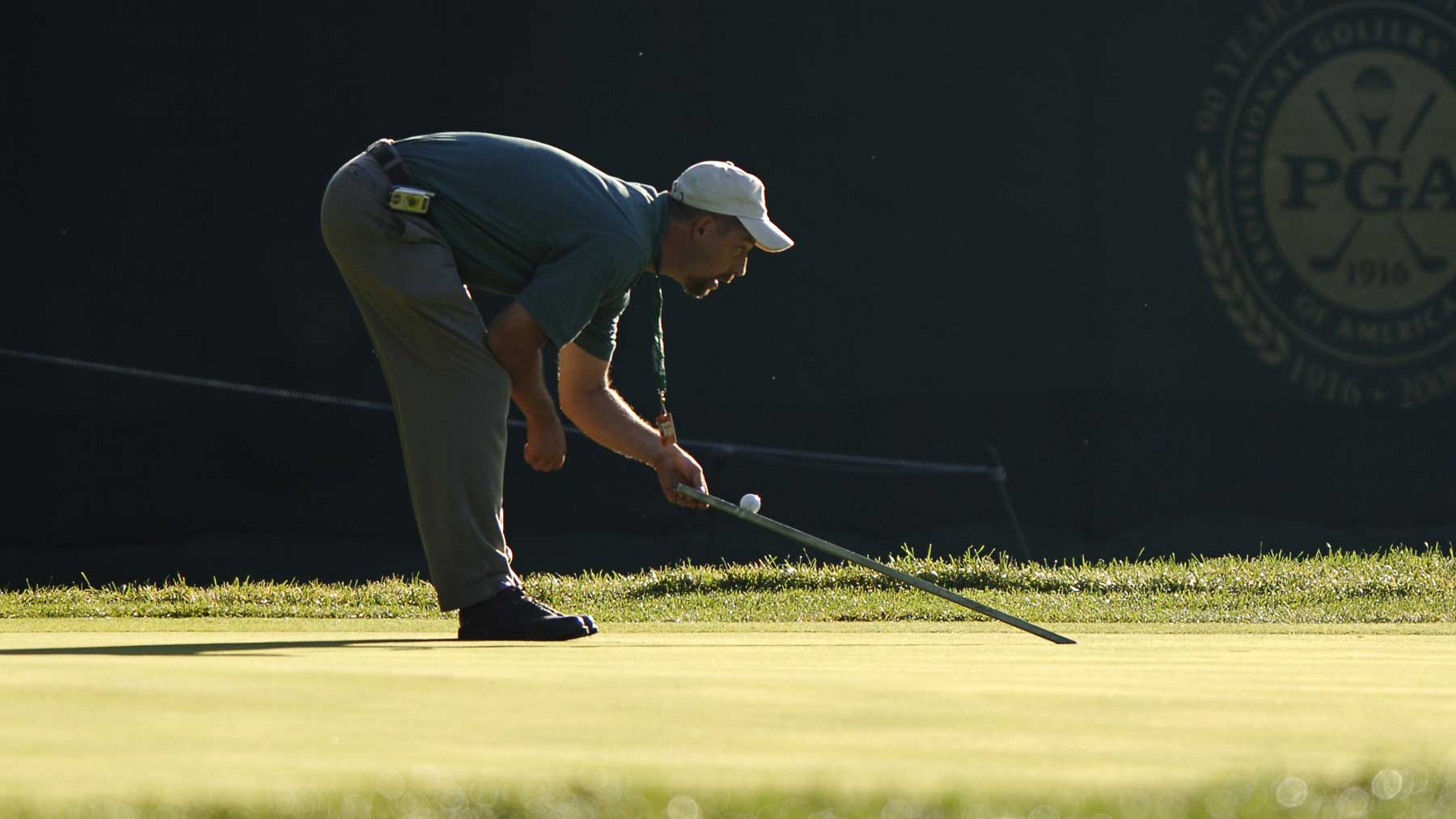 superintendent with a stimpmeter