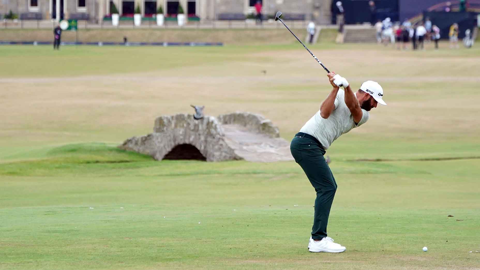 dustin johnson swings on 18 at st. andrews in 2022 open championship