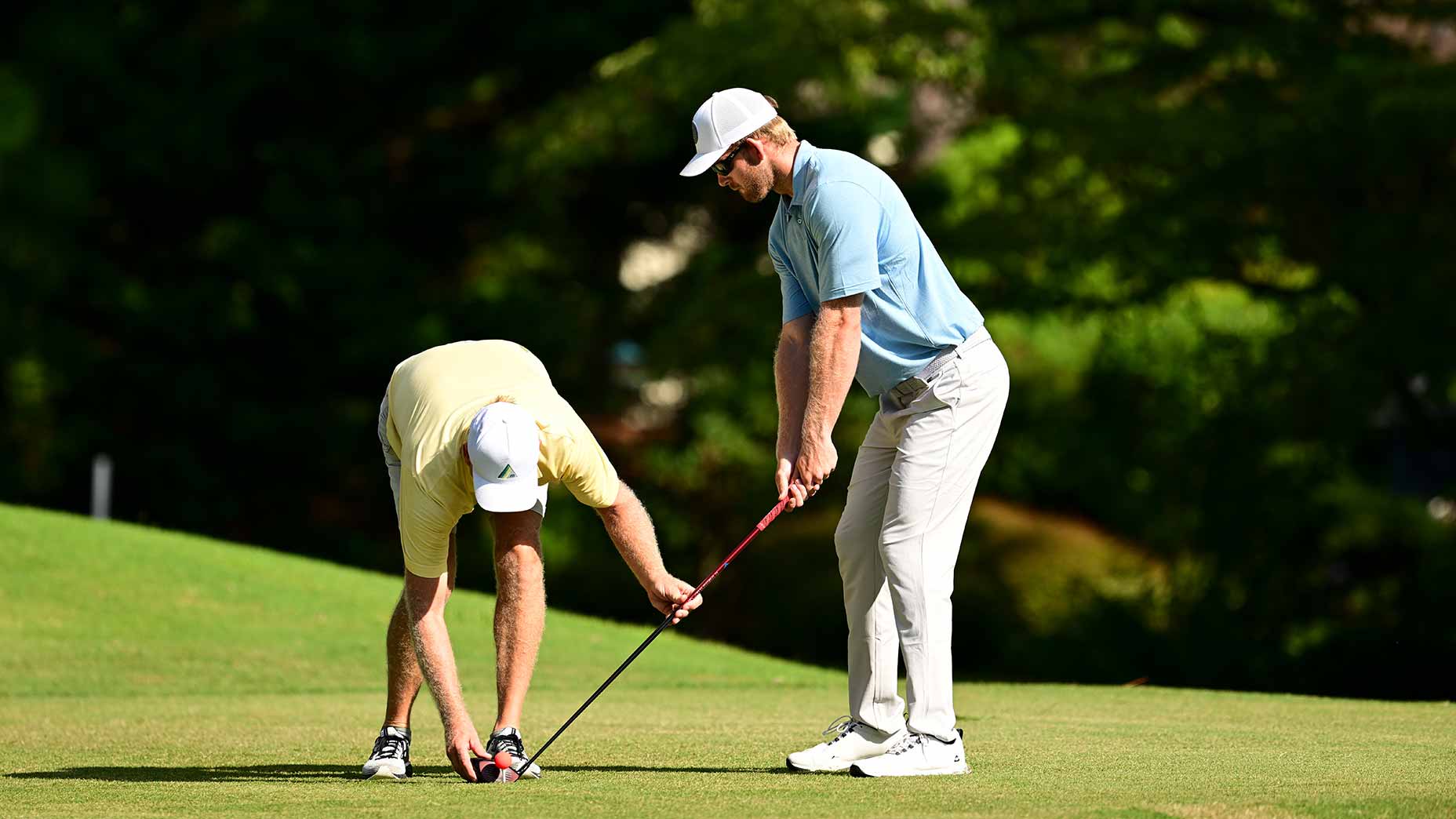 jake and brian olson line up tee shot