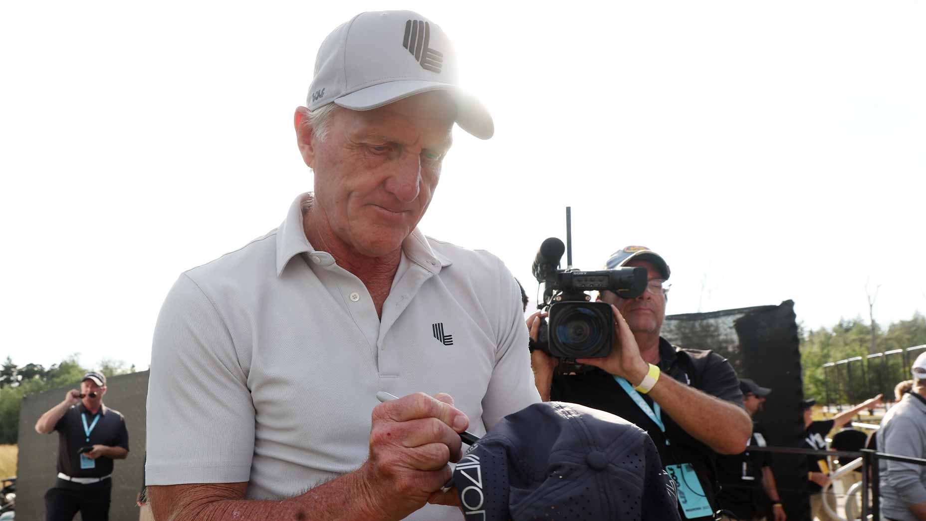 greg norman signs hat