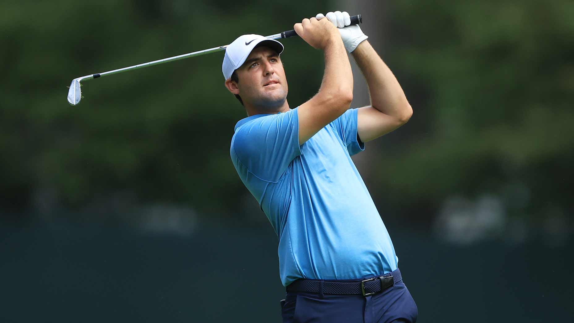 Scottie Scheffler watches an iron shot during 2022 Tour Championship