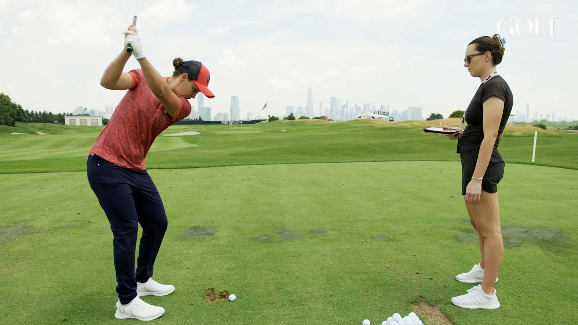 Ash Barty warms up on the range with GOLF's Claire Rogers.