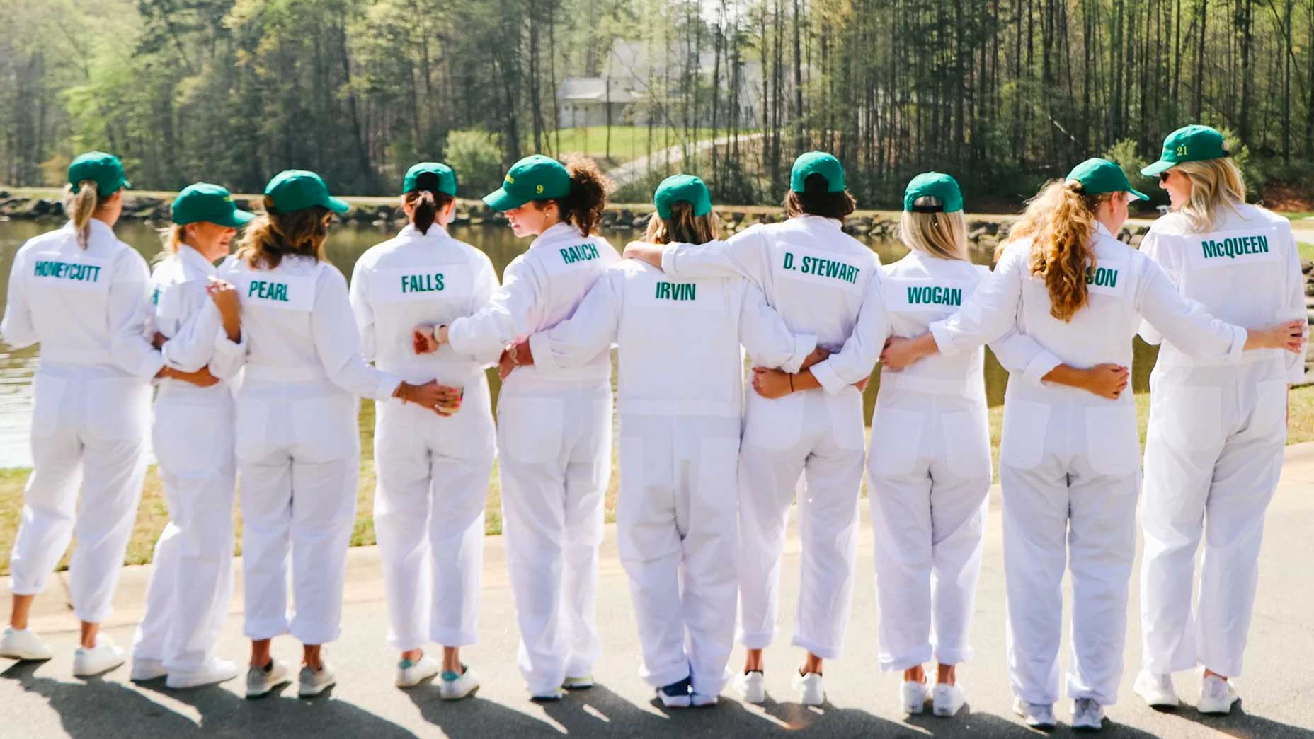 A group of people wearing white caddie bibs