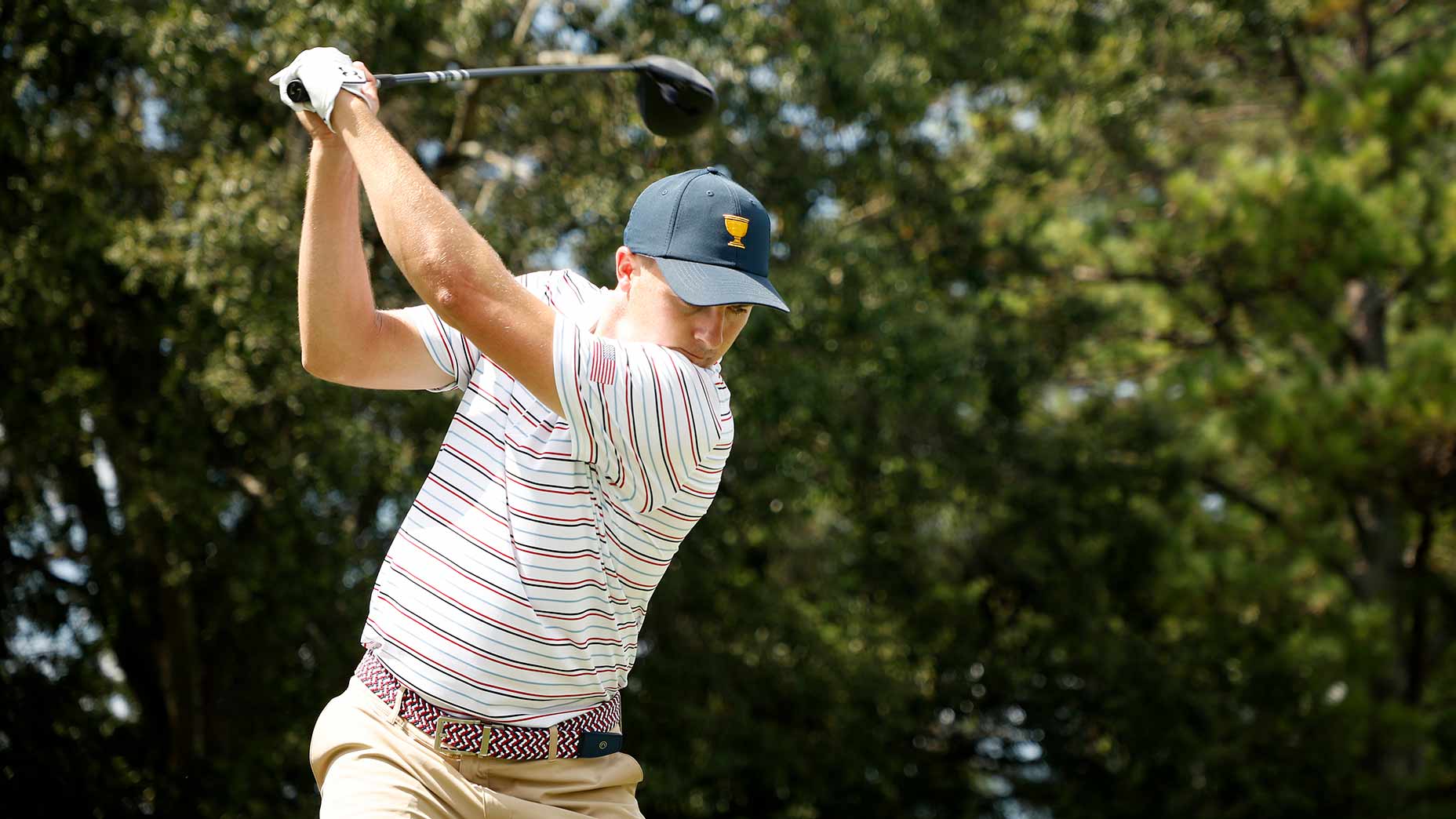 Jordan Spieth hits a tee shot during a Presidents Cup practice round on Monday at Quail Hollow.