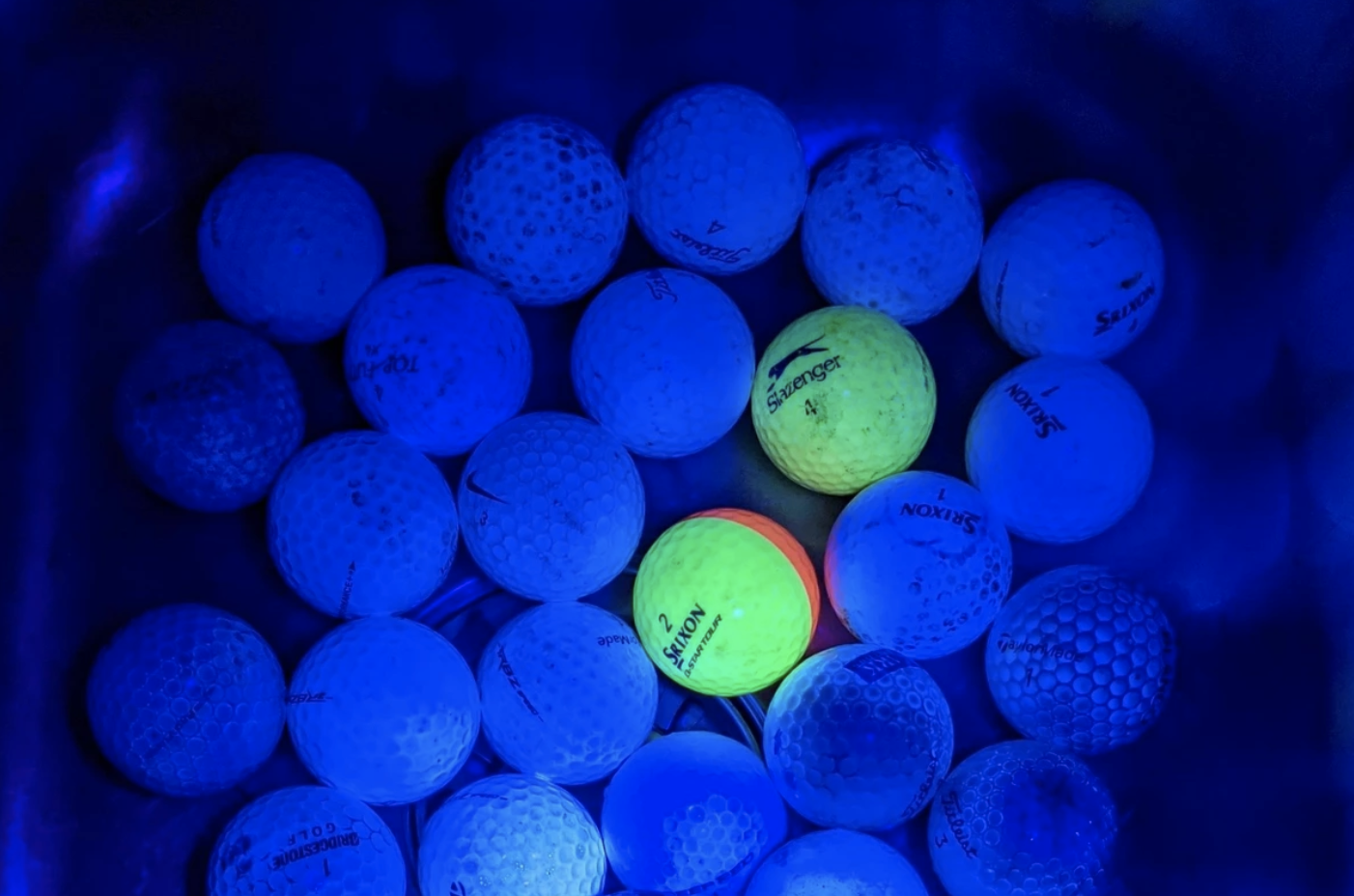 golf balls glowing in dark