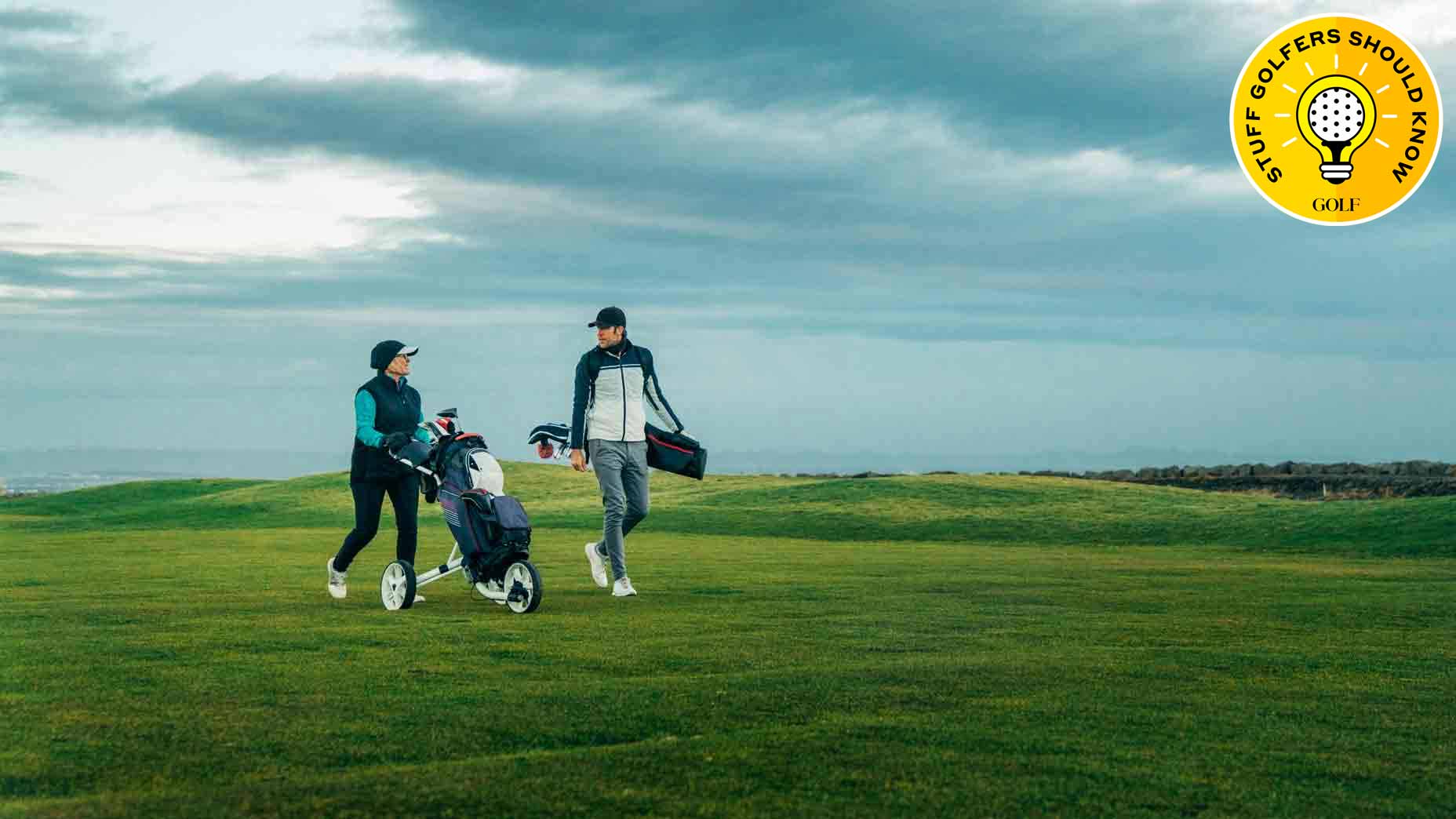 Golfers walking on golf course