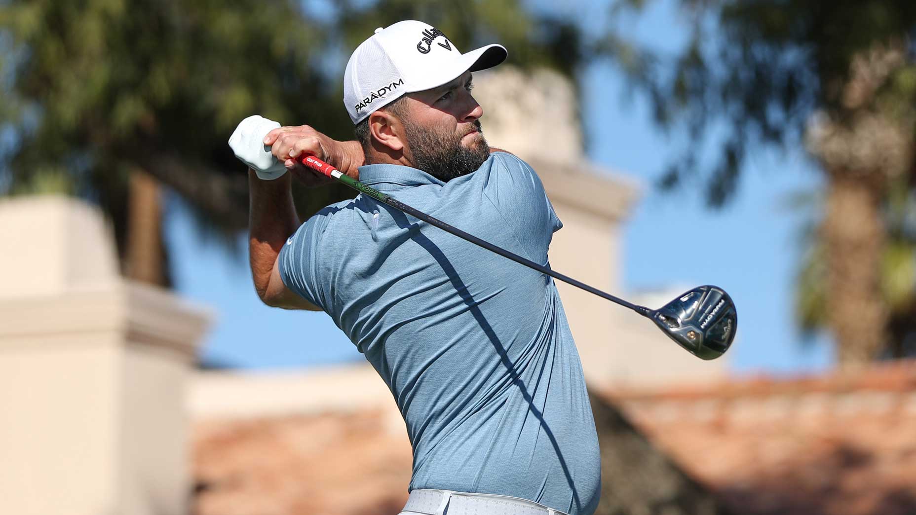 Jon Rahm hits drive during third round of 2023 American Expres