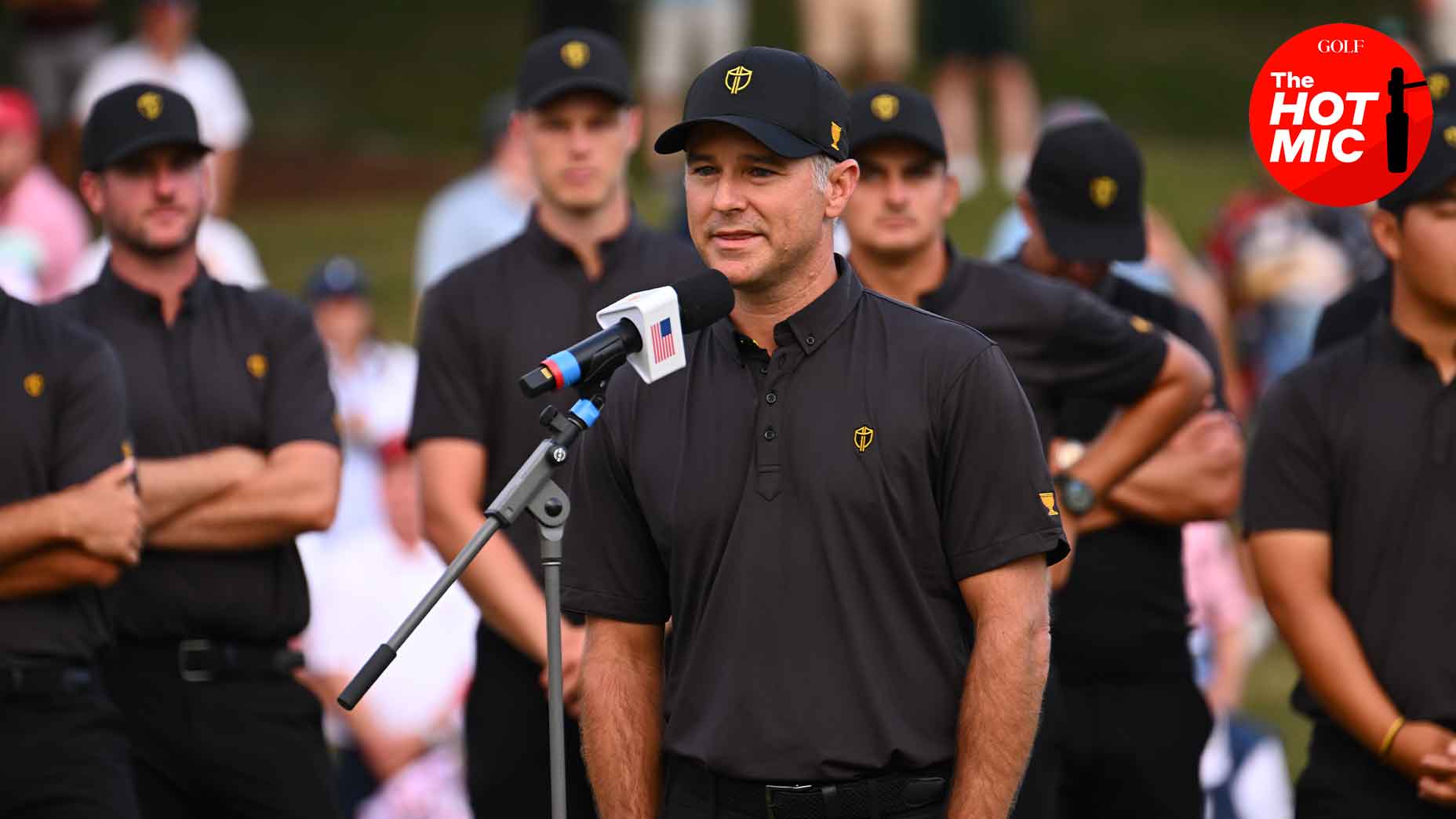 trevor immelman speaks into microphone