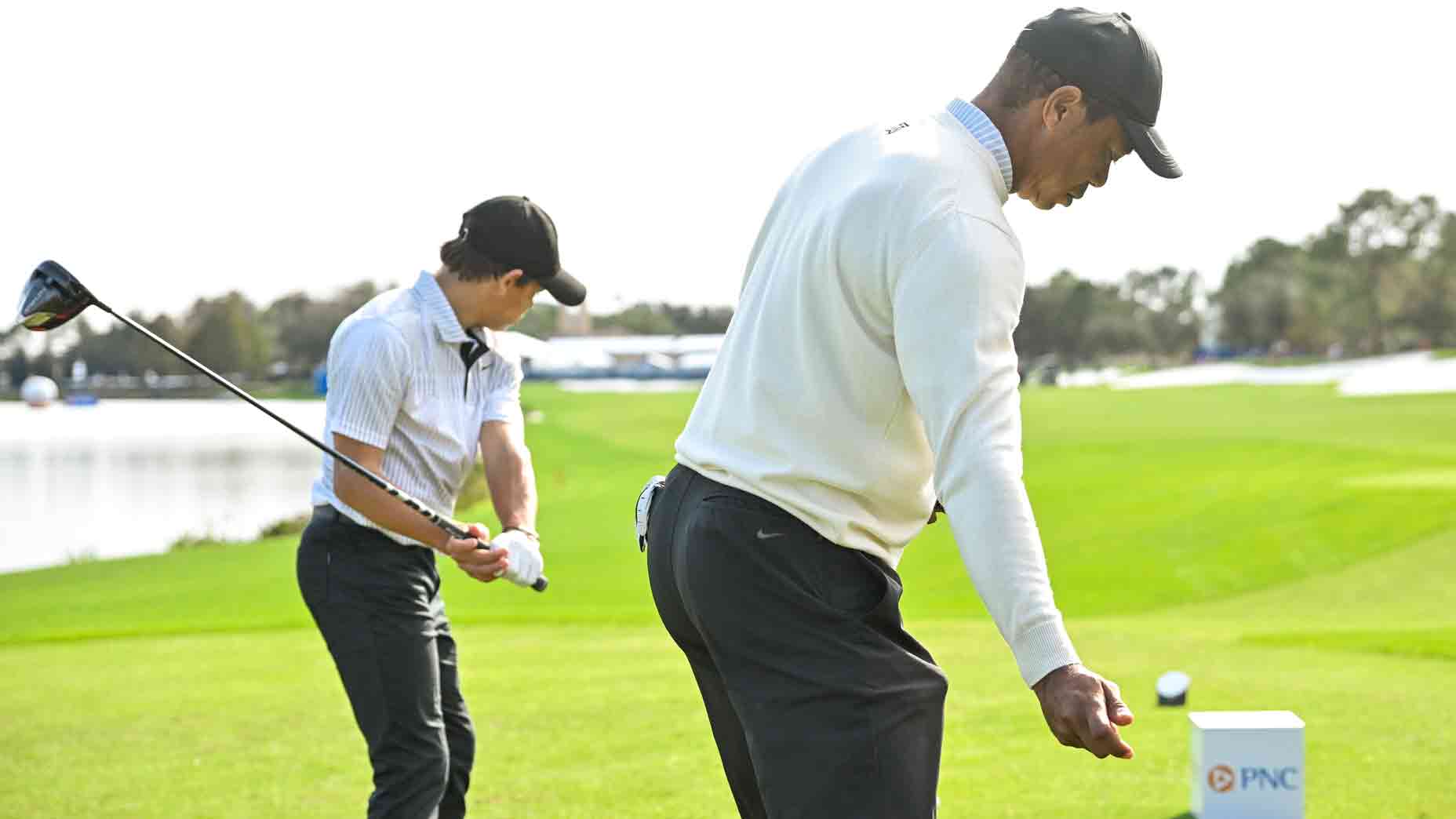 Tiger and Charlie Woods practice swing