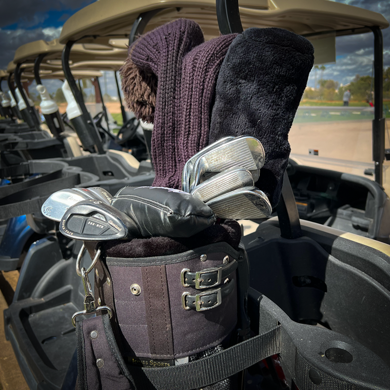 Woods in the back irons and wedges in front