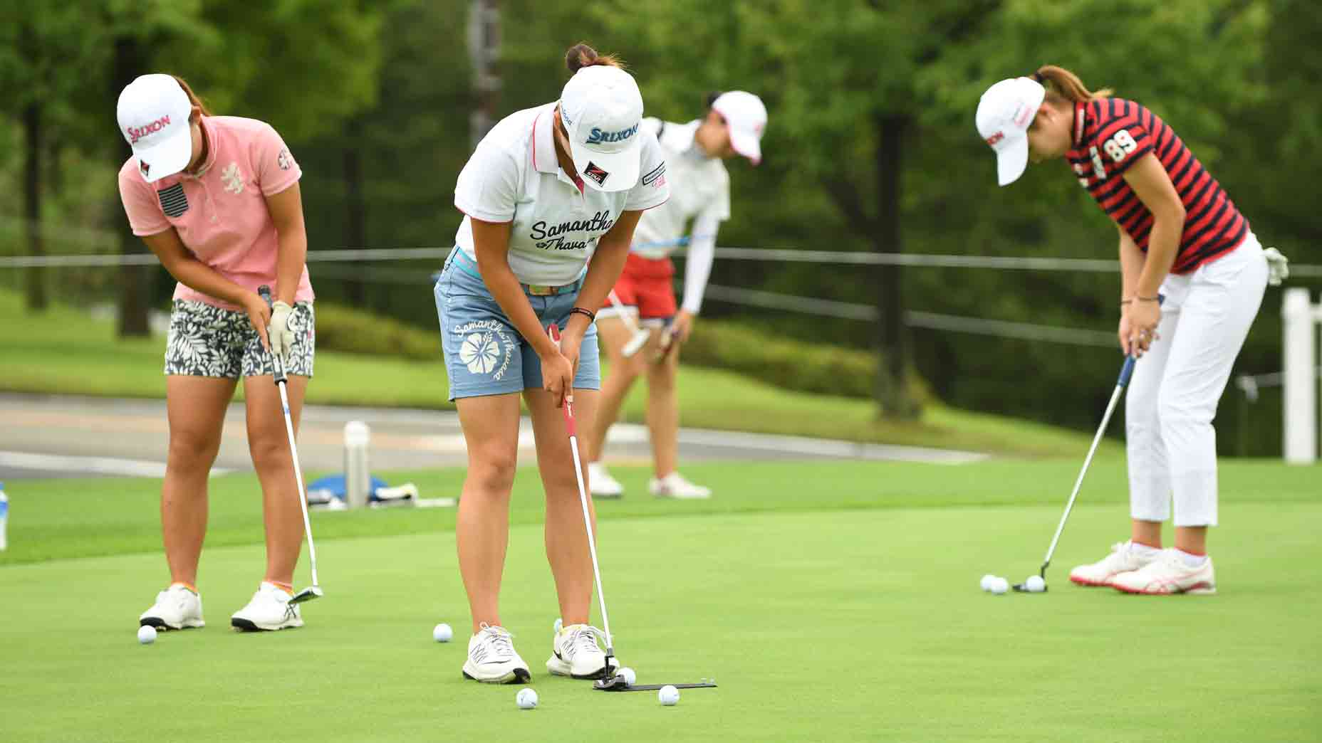LPGA golfers on putting green