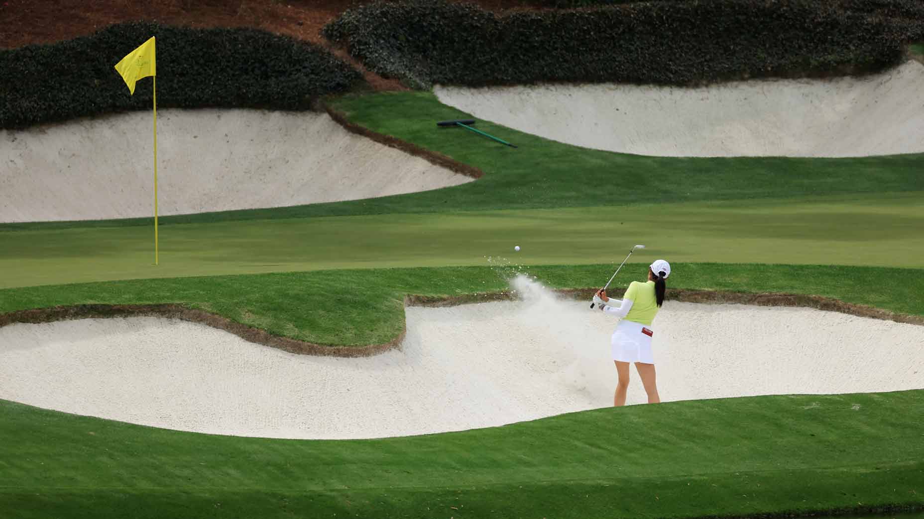 rose zhang hits bunker shot at augusta national