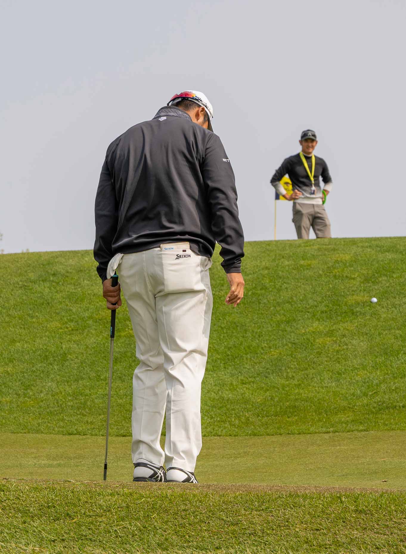 Hideki Matsuyama couldn't get his ball to jump up the slope on 14 Tuesday.