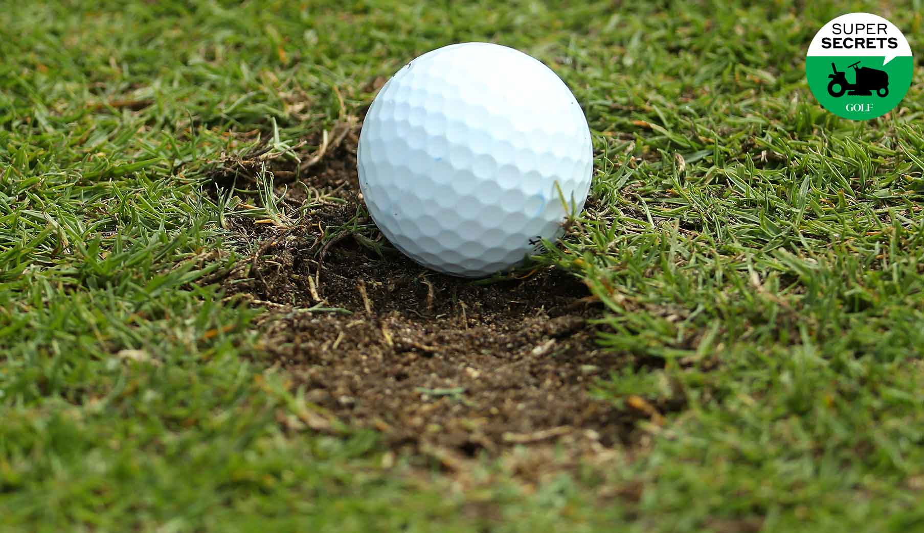 a golf ball in a divot