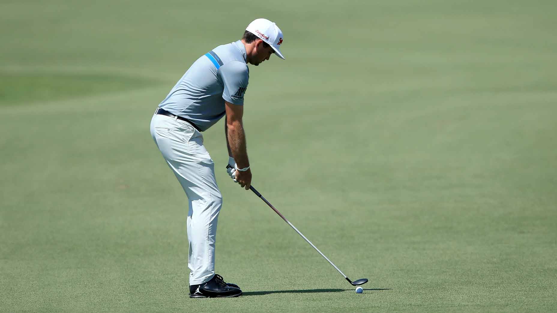 keegan bradley readies to hit a shot