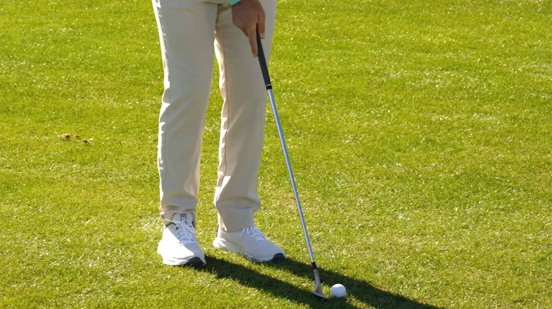 a golfer hits a chip