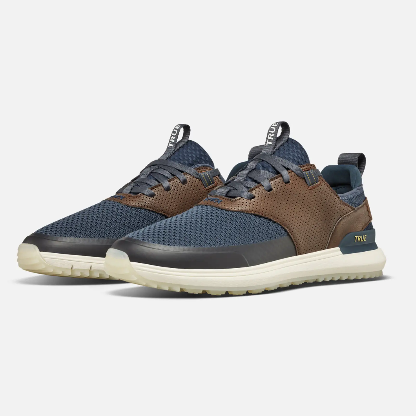 TRUE LUX Hybrid men's golf shoes shown in navy with dark brown accents and an off-white sole.