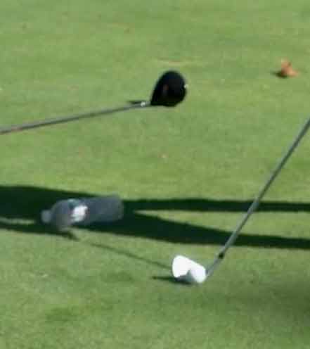 iron on the ground next to water bottle