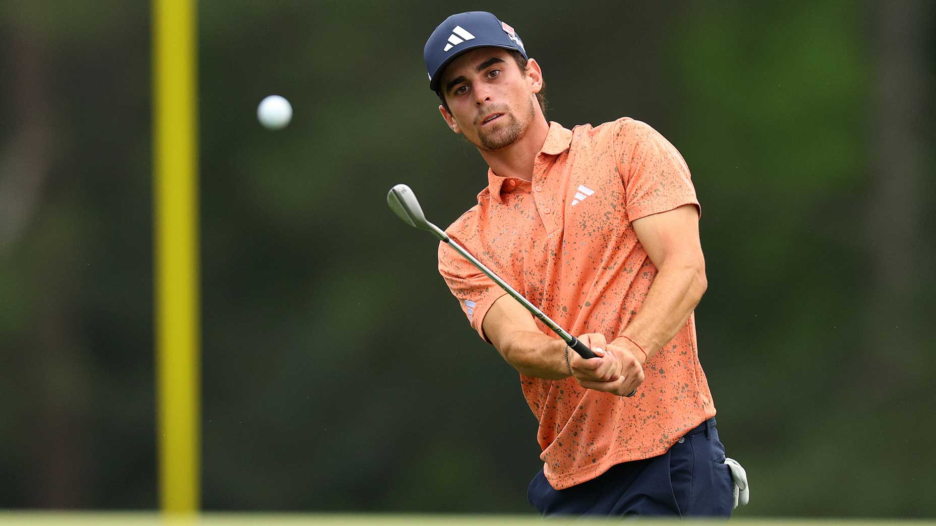 Liv pro Joaquin Niemann plays chip shot during 2023 Masters